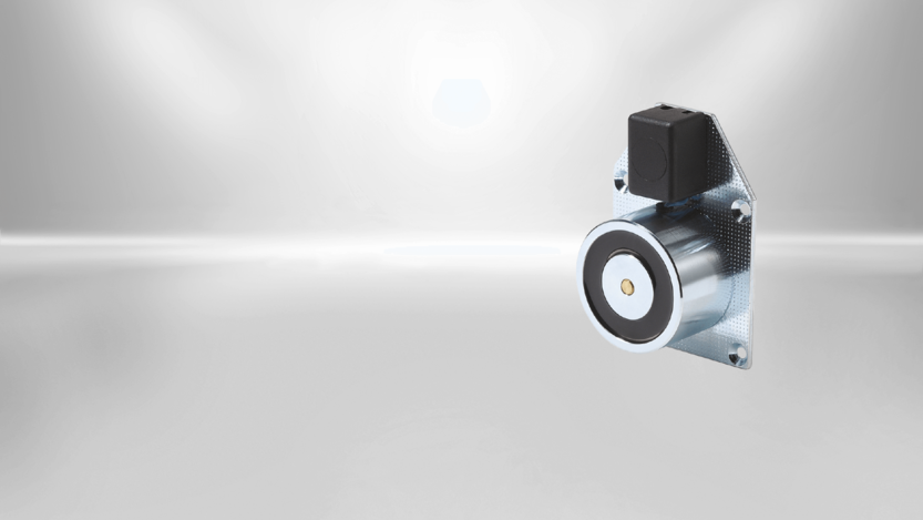 Door holding magnets from Kendrion are available in different designs. This type of SAFE Line is staffed with a steel mounting plate and a two-pole terminal clamp.